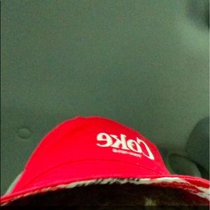 Red reversible Coca Cola hat worn twice.